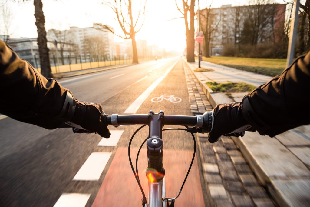 First Person View Of Cyclist In The City At Morning