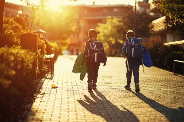 Two Little Boys Returning From School